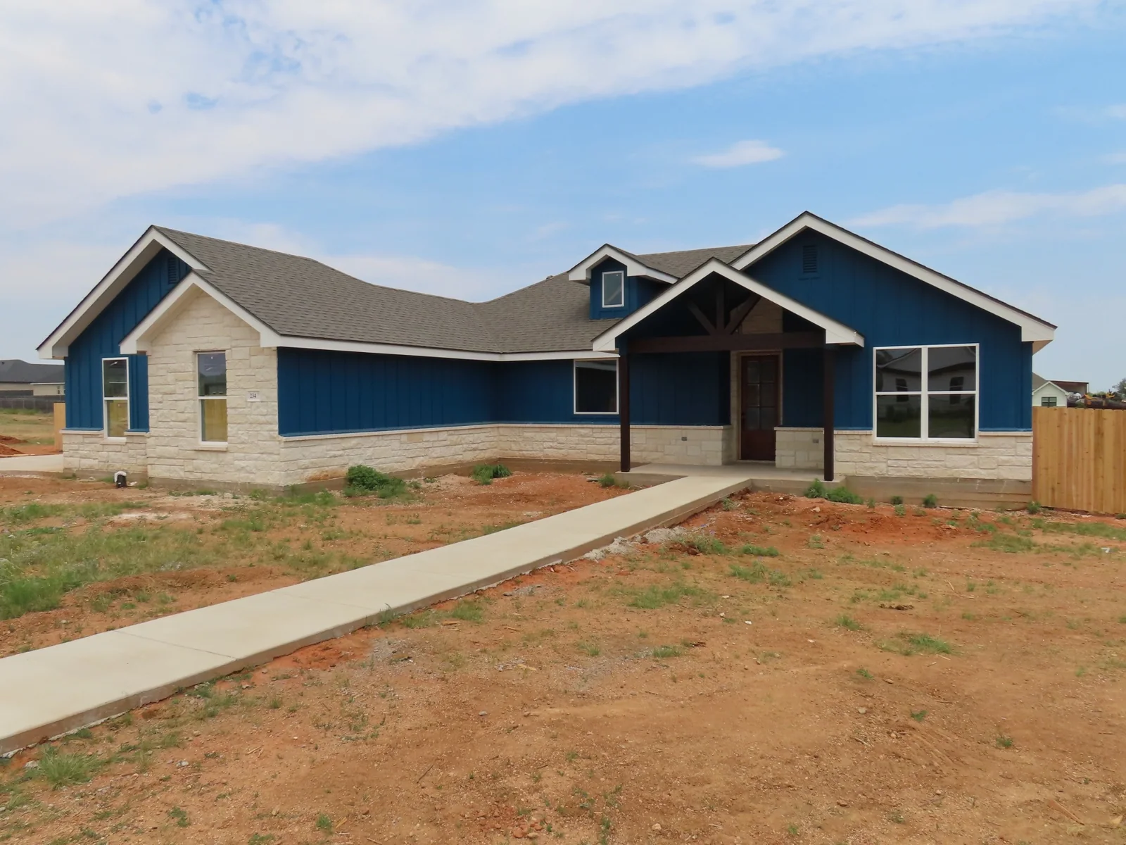Blue siding and light stone on a home exterior